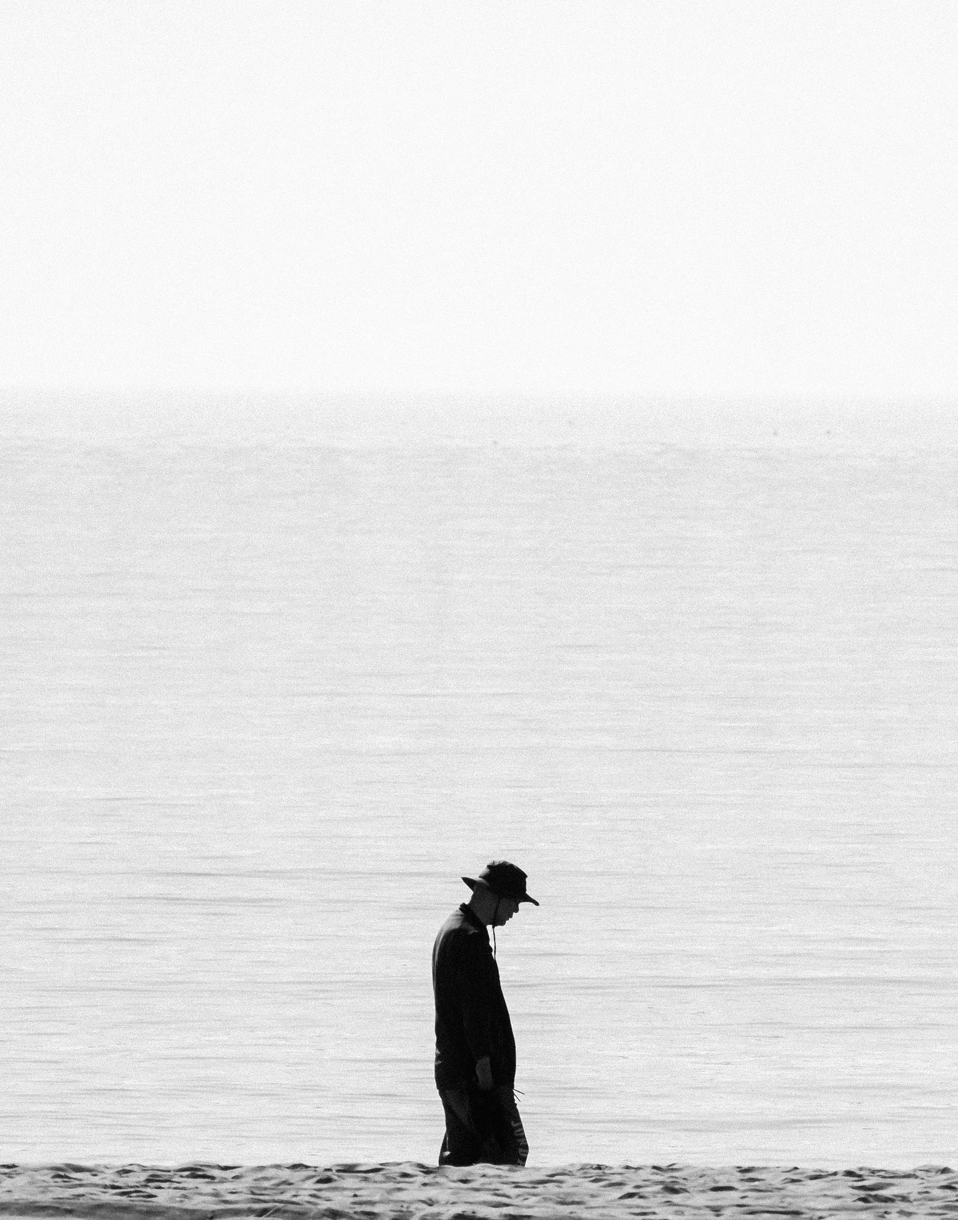 A figure amid rising tides