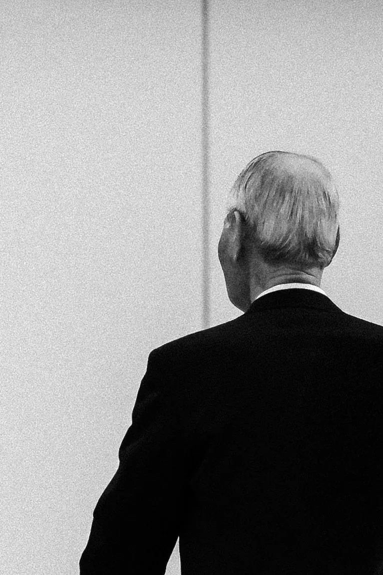 A suited figure alone