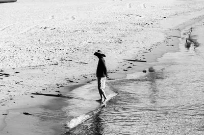 Photograph of a solitary figure from the No One Is Watching series by Mo Badawi