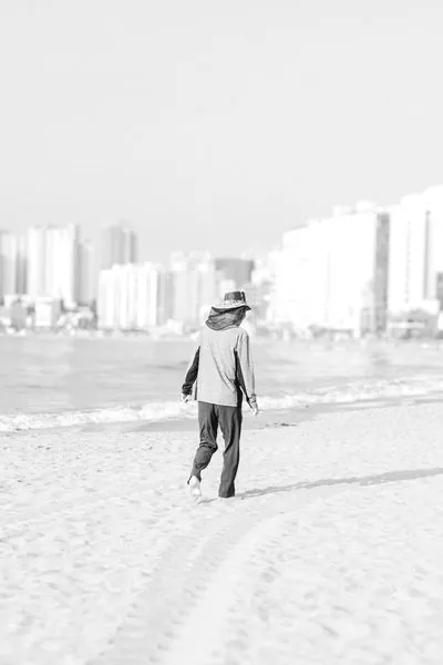 Photograph of a solitary figure from the No One Is Watching series by Mo Badawi
