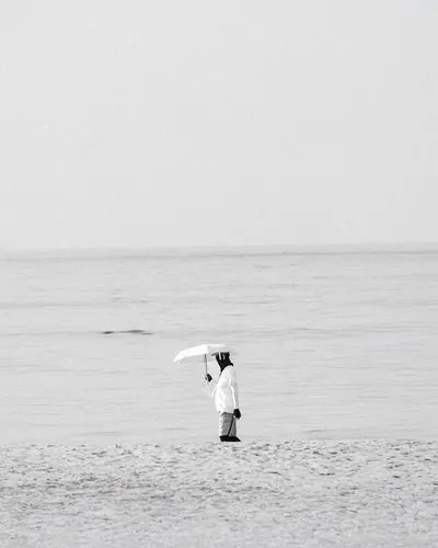 Photograph of a solitary figure from the No One Is Watching series by Mo Badawi
